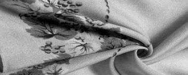 Doku, arka plan, şekil, Crepe de Chin. Bej rengi, mavi çiçekler. Bu bir ipek grubu, pürüzle karakterize edilmiş, aynı zamanda hafif kırışık..