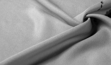 Doku, arka plan, şekil, Crepe de Chin. Bej rengi, mavi çiçekler. Bu bir ipek grubu, pürüzle karakterize edilmiş, aynı zamanda hafif kırışık..