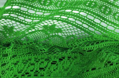 Arkaplan, doku, desen, yeşil dantel kumaş, ince açık kumaş, genellikle pamuktan ya da ipekten yapılmış, halkalar, bükme ya da örgü iplikleri kullanarak desenler halinde yapılmış.