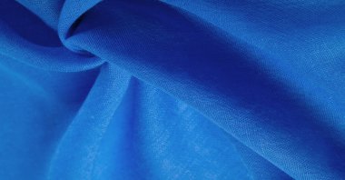 Doku. İpek mavisi mat renginin arka plan kumaşı (boya veya yüzey) sönük ve düzdür, parlaklığı yoktur..