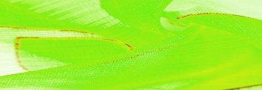 Arka plan dokusu bir organza deseni. İnce, şeffaf kumaştan bir kumaş. İnce, yapışkan ipekten bir peçe gibi. yeşil beyaz sarı gri geometrik renkler