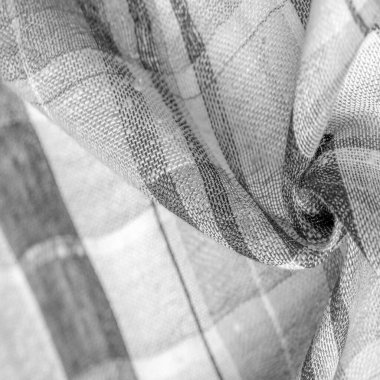 İskoç dokusunun arka plan dokusu, ki bu dokunun adı doğrudan ülkenin kökenini gösterir. Bu materyalin ikinci ve daha doğru adı tartan..