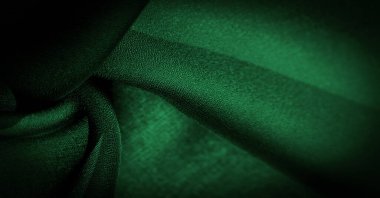 Arkaplan dokusu Koyu yeşil şifon ipeği hafif pürüzlü yumuşak şeffaf bir kumaştır (matte, creped) bükülmüş iplik kullanımı nedeniyle.