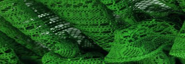 Arkaplan, doku, desen, yeşil dantel kumaş, ince açık kumaş, genellikle pamuktan ya da ipekten yapılmış, halkalar, bükme ya da örgü iplikleri kullanarak desenler halinde yapılmış.