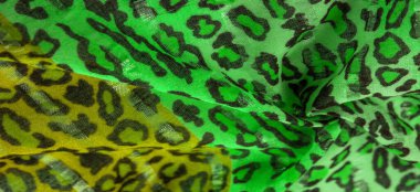 Doku, arkaplan, desen, ipek kumaş yeşil, leopar desenli. Hafif leopar desenli ipek tasarımınız için mükemmel, şık görünüyor ve kaba değil.!