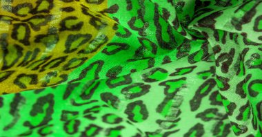 Doku, arkaplan, desen, ipek kumaş yeşil, leopar desenli. Hafif leopar desenli ipek tasarımınız için mükemmel, şık görünüyor ve kaba değil.!