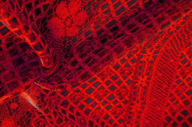 Doku, arka plan, desen. Yakut kırmızısı dantel kumaş, kırmızı ve siyah kumaşın karışımı. Kızarır, kızarır, kızarır, kızarır.