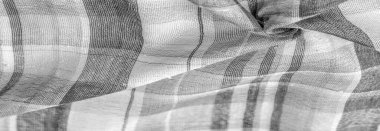 İskoç dokusunun arka plan dokusu, ki bu dokunun adı doğrudan ülkenin kökenini gösterir. Bu materyalin ikinci ve daha doğru adı tartan..