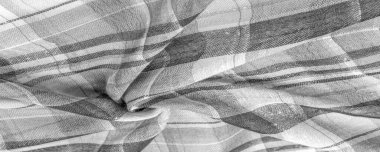 İskoç dokusunun arka plan dokusu, ki bu dokunun adı doğrudan ülkenin kökenini gösterir. Bu materyalin ikinci ve daha doğru adı tartan..