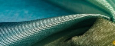 Arkaplan dokusu, ipek kumaş, parlak yeşil yeşil renk, küçük soyut kaya resimleri..