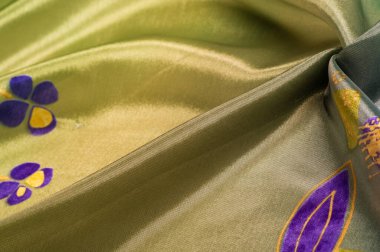 Arkaplan dokusu, ipek kumaş, parlak yeşil yeşil renk, küçük soyut kaya resimleri..