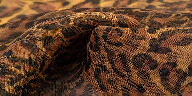 doku, ipek kumaş, leopar derisi, kahverengi-sarı siyah tonlar, sıcak Afrika safarisi,