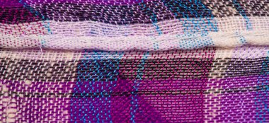 İskoç dokusunun arka plan dokusu, ki bu dokunun adı doğrudan ülkenin kökenini gösterir. Bu materyalin ikinci ve daha doğru adı tartan..