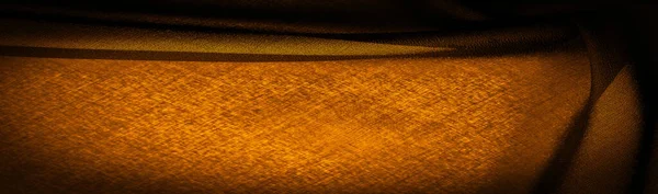背景の質感ダークセピアブラウンイエローのシフォンシルクは ツイスト糸の使用により若干のラフネス マット クリップ を持つ柔らかい透明生地です — ストック写真