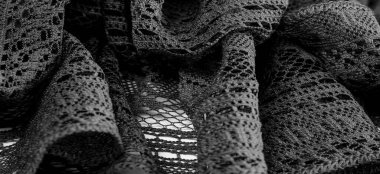 Arkaplan, doku, desen, siyah dantel kumaş, ince açık kumaş, genellikle pamuktan ya da ipekten yapılmış, halkalar, kıvrımlar ya da örgü iplikleriyle örülmüş.