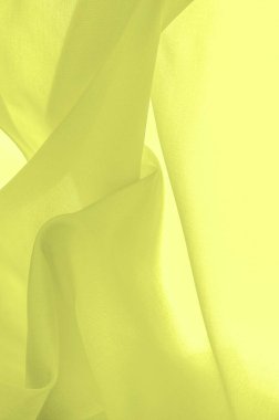 Arkaplan dokusu, Çelik Sarı İpek Dupioni, Duppioni veya Dupion. Bu geri döndürülebilir, çıtır çıtır, orta yoğunluklu, tüylü ve yumuşak dokuması olan bir ipek kumaştır. Kırışmıyor.