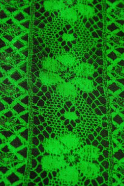 Doku, arka plan, desen. Zümrüt yeşili dantel kumaş. Siyah kumaşla yeşil kumaşın karışımı. Verdant, lawny, virid, dana eti