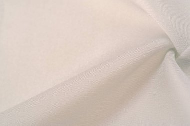 Arkaplan dokusu, Platin renkli İpek Dupioni, Duppioni ya da Dupion. Bu geri döndürülebilir, gevrek, orta yoğunluklu, tüylü ve yumuşak dokuması olan bir ipek kumaştır. Kırışmıyor.