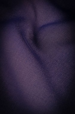 Arkaplan dokusu Koyu mavi şifon ipeği yumuşak şeffaf bir kumaştır ve pürüzlüdür (matte, creped) çünkü bükülmüş iplik kullanımı.