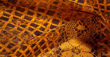 Doku, arka plan, desen. Altın dantel, siyah kumaşla sarı altın karışımı. kırmızı, ahtapot, metallerin kralı, toprak rengi