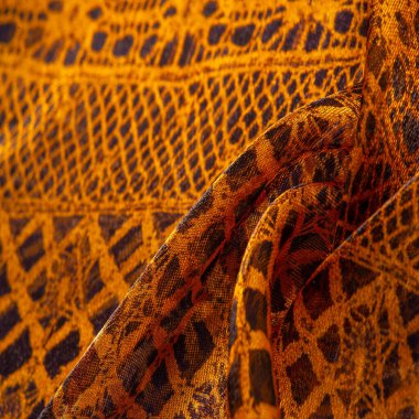 Doku, arka plan, desen. Altın dantel, siyah kumaşla sarı altın karışımı. kırmızı, ahtapot, metallerin kralı, toprak rengi