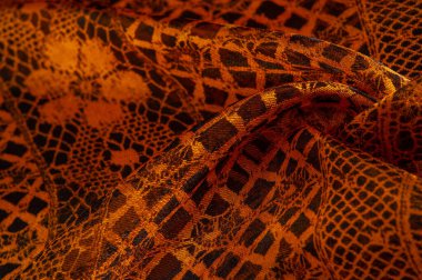 Doku, arka plan, desen. Altın dantel, siyah kumaşla sarı altın karışımı. kırmızı, ahtapot, metallerin kralı, toprak rengi