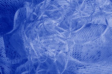 Doku, arka plan mavi tül. Bu olağanüstü naylon tülü kullanarak bir aksesuara hacim, yetenek ya da detaylı tasarım ayrıntıları ekleyin! Yumuşak tül tasarım gereksinimlerinizi karşılıyorsa, diğer kalıplara bakın