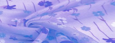 Arkaplan deseni, ipek kumaş, eflatun arkaplanda küçük çiçekler, baskılı ince bir gök mavisi rengi. Çiçek tasarımı