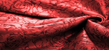 relief pattern, composite textiles, red silk fabric, with a floral pattern, unusually pleasant visual sensations: slippery, coolness, softness; beautiful appearance, unique luster;