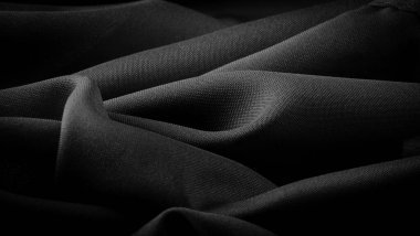 Doku, arkaplan, desen, saten siyah genellikle parlak bir yüzeye ve donuk bir sırta sahip, saten dokuma dört ya da daha fazla dolgu ipliği ile karakterize edilir.,