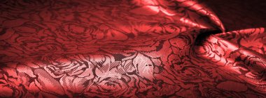 relief pattern, composite textiles, red silk fabric, with a floral pattern, unusually pleasant visual sensations: slippery, coolness, softness; beautiful appearance, unique luster;