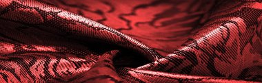 relief pattern, composite textiles, red silk fabric, with a floral pattern, unusually pleasant visual sensations: slippery, coolness, softness; beautiful appearance, unique luster;