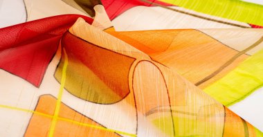 Arka plan dokusu bir organza deseni. İnce, şeffaf kumaştan bir kumaş. İnce, yapışkan ipekten bir peçe gibi. yeşil kırmızı kırmızı geometrik renkler