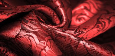 relief pattern, composite textiles, red silk fabric, with a floral pattern, unusually pleasant visual sensations: slippery, coolness, softness; beautiful appearance, unique luster;