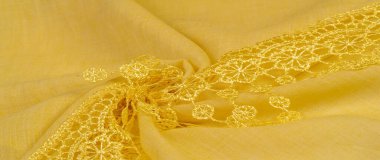 Doku, arkaplan, desen, kartpostal, ipek kumaş, dantel ambalajlı kadın sarı atkısı. Yazdırma ve dijital materyallerinizi oluşturmak için bu süslü resimleri kullanın.