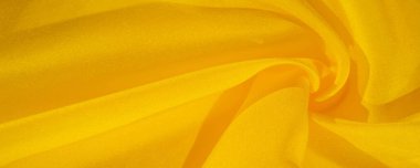 Doku arka plan deseni, sarı kumaş ipek. Krep saten arka tasarım için mükemmel bir kumaş, bir yandan bir saten bitirmek ve diğer - krep, hangi geri dönüşümlü hale getirir
