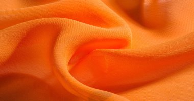 arka plan, desen, doku, Turuncu ipek kumaş parlak bir parlaklık vardır. Bu draping yumuşak kıvrımlar içine katlanır ve en çok yönlü kumaştır. Tasarımınızın güzel vurgularıyla yaratıcı olun.