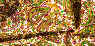 Arka plan dokusu, desen, desenli kumaş pamuk. Özgür Ruh için Kaffe Fassett tarafından tasarlanan bu büyük desenli paletin renk tonları, sıcak pembe, kobalt mavisi, fuşya ve mor ile yeşilin tonlarıdır..