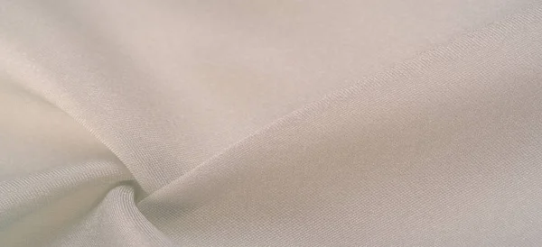Background texture, Platinum-colored Silk Dupioni, Duppioni or Dupion This is a reversible, crisp, medium-density silk fabric with a fleecy texture and friable smooth weave. It does not crumple