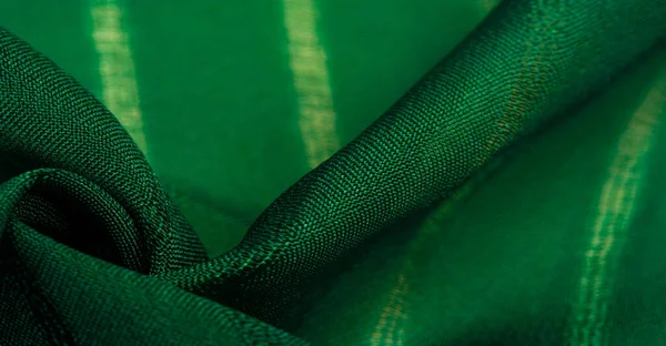 Texture, background, pattern, simple green fabric with lines. The lines formed by the extraction of the thread,