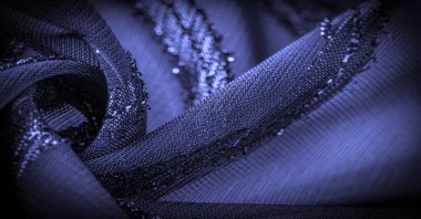 Doku arkaplan resmi, kumaş şeffaf koyu mavi, parlak doğuştan gelen çizgilerle, ışığın içinden geçmesine izin veren madde, böylece nesneler açıkça görülebilir..