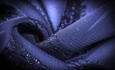 Doku arkaplan resmi, kumaş şeffaf koyu mavi, parlak doğuştan gelen çizgilerle, ışığın içinden geçmesine izin veren madde, böylece nesneler açıkça görülebilir..