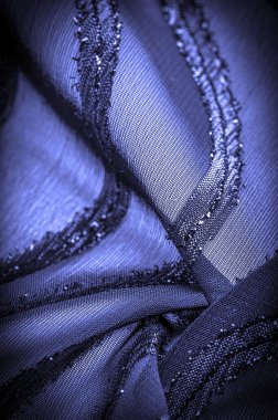 Doku arkaplan resmi, kumaş şeffaf koyu mavi, parlak doğuştan gelen çizgilerle, ışığın içinden geçmesine izin veren madde, böylece nesneler açıkça görülebilir..