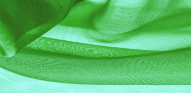 Yeşil ipek kumaş dokusu. Tasarımınız, giysileriniz ve posterleriniz için de mükemmel. Güzel proje aksanlarıyla yaratıcı ol. Bu kumaş senin ilham kaynağın..