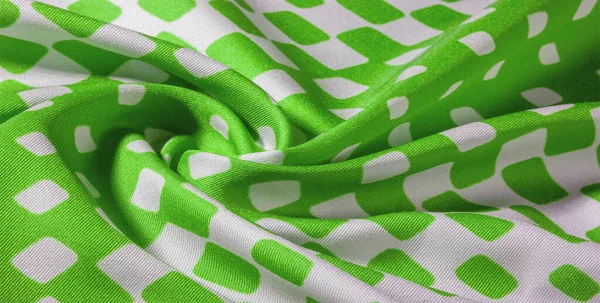 texture background pattern. Silk fabric with a pattern of green squares on a white background. This is a heavy square 100% polyester pattern that fits perfectly with modern, transitional or contemporary design.