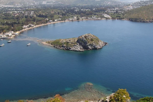 Aerial high angle view of Rabbit Island in Gumusluk bay, Bodrum. Gumusluk, a seaside village and fishing port in Turkey, is situated on the remains of the ancient city of Myndos