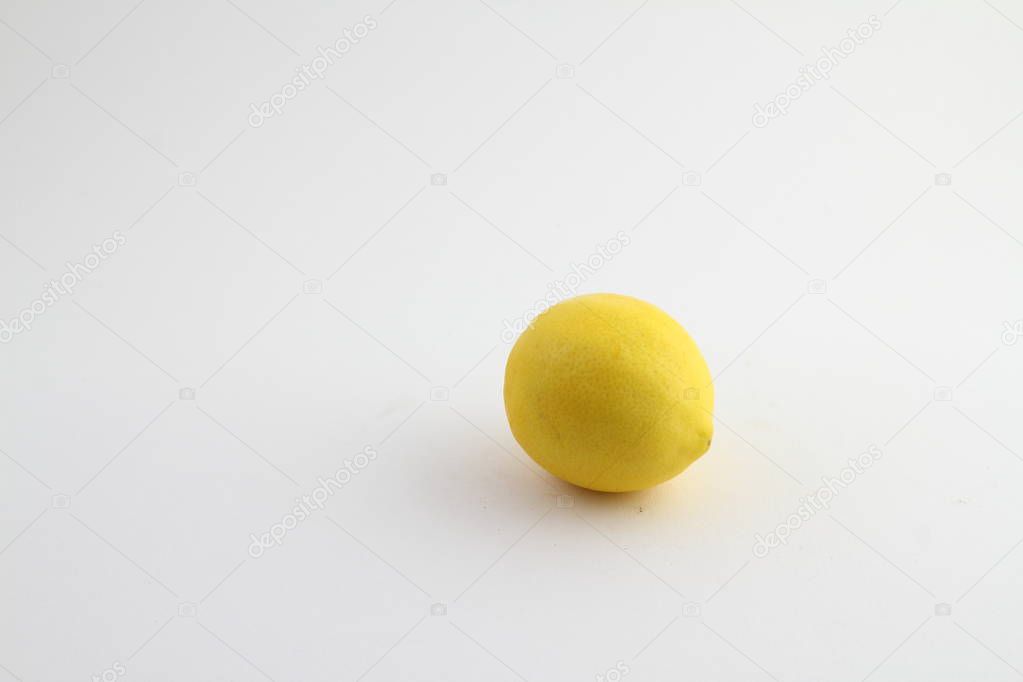 Fresh lemon on a white background. One lemon close up isolated on a white background.