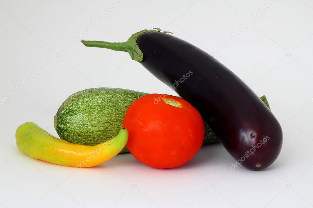 Tomatoes , zucchini, eggplant on isolated white background.