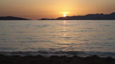 Denizin üzerinde gün batımı. Turgutreis / Bodrum