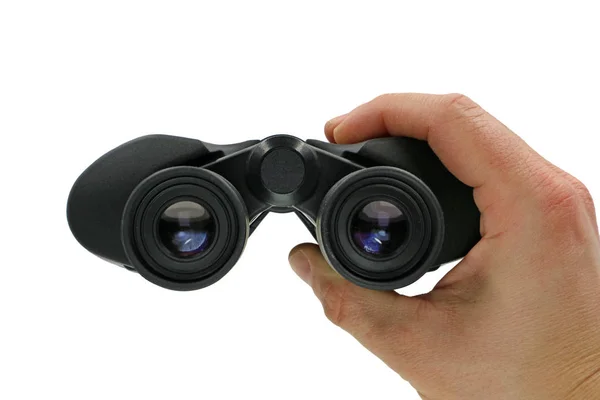 Close up, front view of hand holding black binoculars on white background — Stock Photo, Image